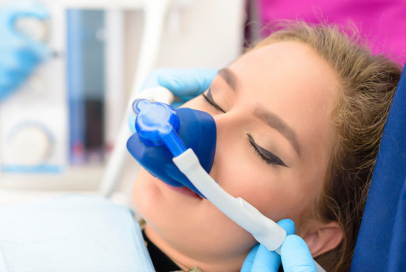 patient undergoing sedation for dental procedure