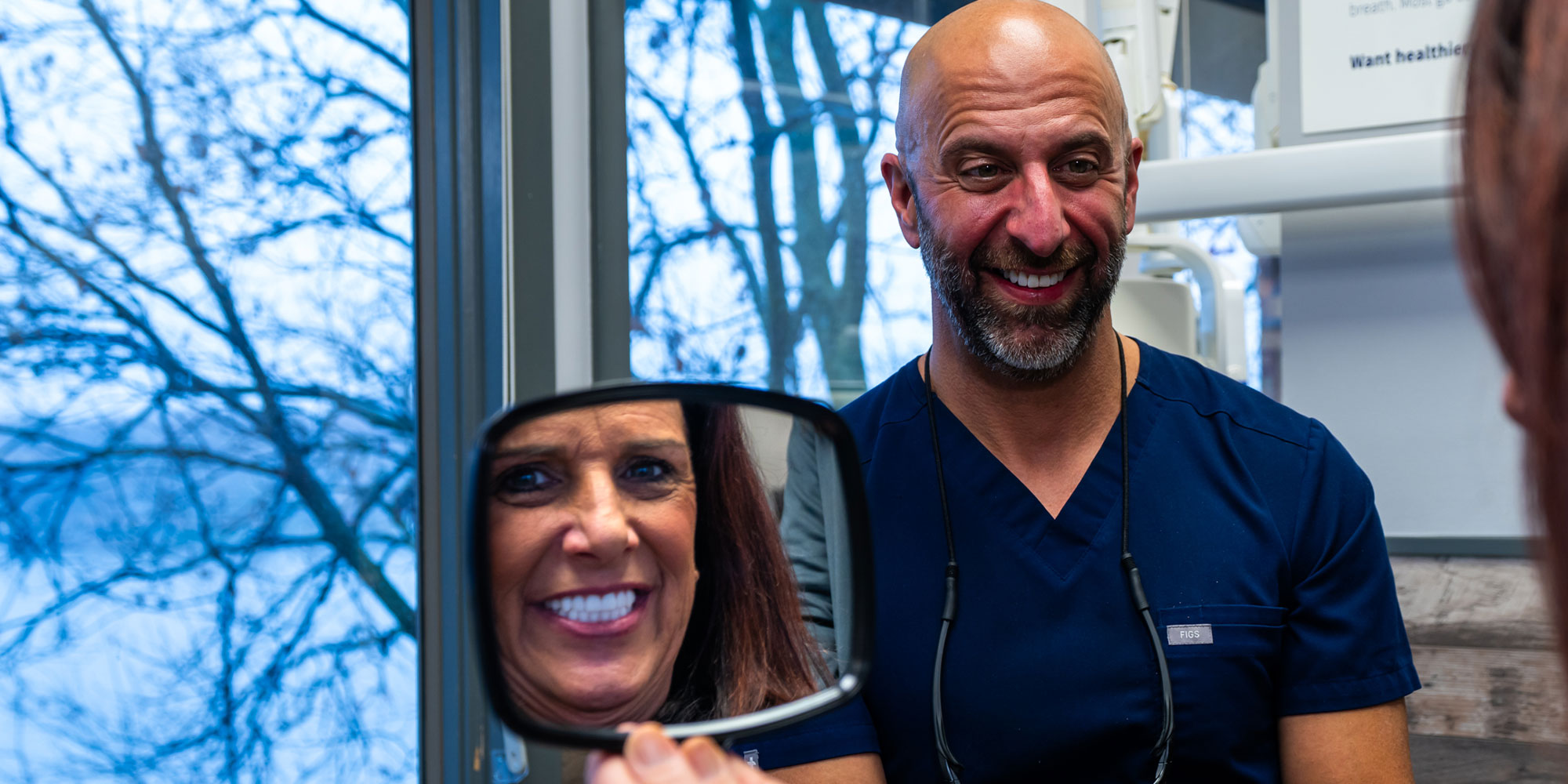 Patient Smiling into Mirror