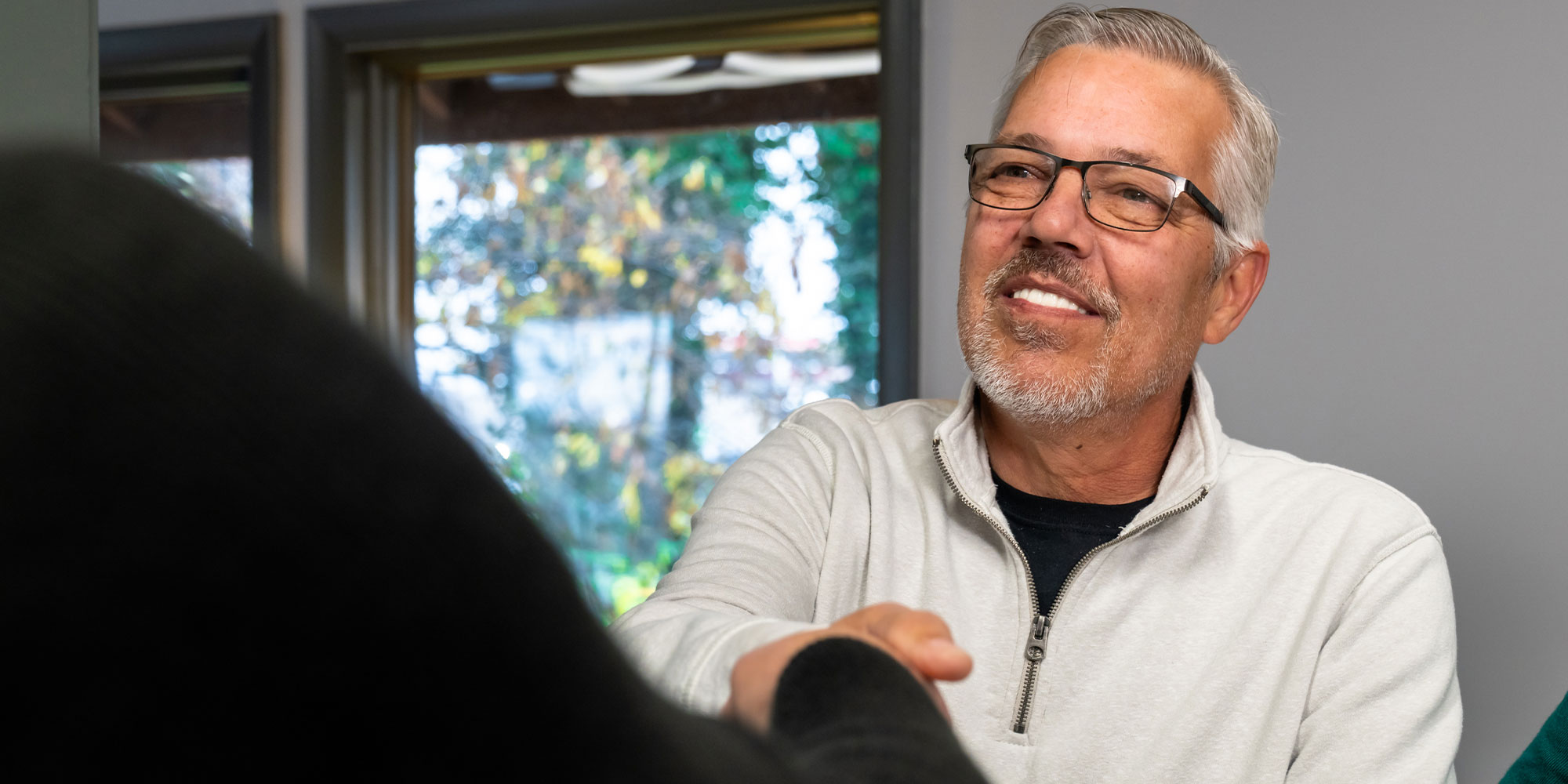 Patient Smiling at team member